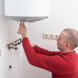 Man Repairing Water Heater